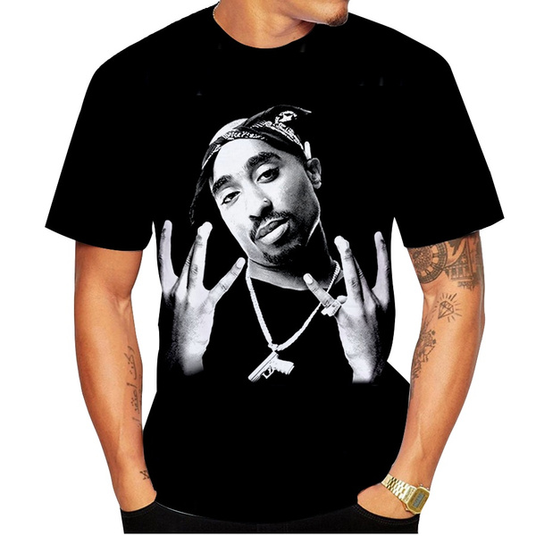 A view of the new wax figure of music icon Tupac Shakur at Madame... | Tupac,  Tupac shakur, Hard tattoos